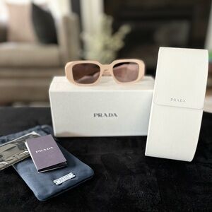 AUTHENTIC Prada Symbole sunglasses
Plum Beige- Never Worn
